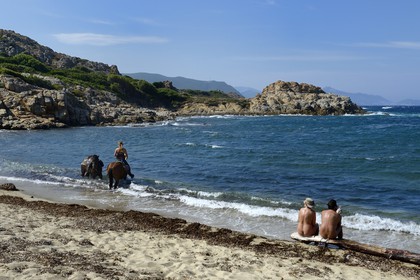 France, Haute Corse, Nebbio, Agriates Desert, Peraiola Cove, rider on Ostriconi beach