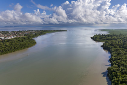 France, French Guiana, Kourou, Kourou river estuary, the town on the left and the Îles du Salut in the background (aerial view)