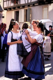 France, Haut Rhin, Eguisheim village, labelled Les Plus Beaux Villages de France (The Most Beautiful Villages of France), wine celebration, Alsatian girl in costumes