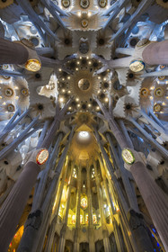 Spain, Catalonia, Barcelona, Eixample district, Sagrada Familia basilica by Catalan modernist architect Antoni Gaudi, listed as a UNESCO World Heritage Site, view from the vault at the nave and transept crossing which symbolizes the heavenly Jerusalem, the apse is at the bottom, the east on the right, the west on the left