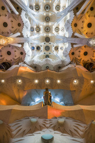 Spain, Catalonia, Barcelona, Eixample district, Sagrada Familia basilica by Catalan modernist architect Antoni Gaudi, listed as a UNESCO World Heritage Site, the bronze statue of Saint George (Sant Jordi) by the sculptor Subirachs in the center of the interior of the facade of Glory and the vault of the Nave at the top