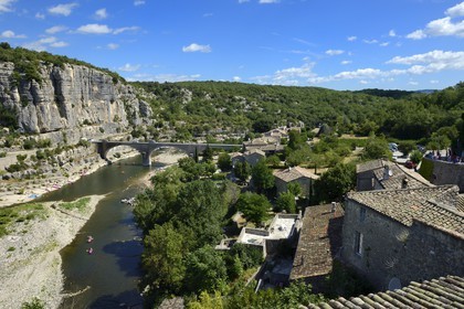 France, Ardeche, Balazuc, labelled Les Plus Beaux Villages de France (The Most Beautiful Villages of France), kayaks going down the Ardeche River