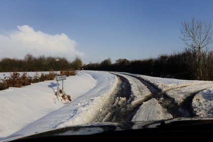 France, Manche, Cotentin, Sainte Mere Eglise, snowy road