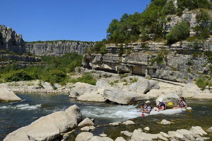 France, Ardeche, Ruoms, kayaks going down the Ardeche River in the Ruoms to Pradons Narrow Pass, rapids at the cirque de Giens