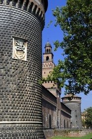 Italy, Lombardy, Milan, Castello Sforzesco (Sforza Castle), built in the 15th century by Duke of Milan Francesco Sforza, one of the two round towers which sheltered cisterns and the Torre del Filarete built by architect Antonio di Pietro Averlino (or Averulino) also known as Filarete