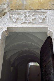 France, Alpes-Maritimes, Bevera Valley, Sospel, lintel engraved with the monogram IHS meaning Jesus savior of men that keeps evil spirits away from the house, building of the Corvesi family (which explains the carved raven)