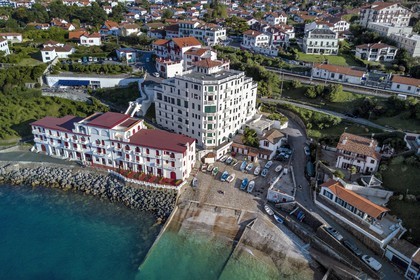 France, Pyrenees Atlantiques, Basque Country coast, Guethary, old whaling port overlooked by the former art deco Guétharia hotel built in the 1920s turned into a residence (aerial view)