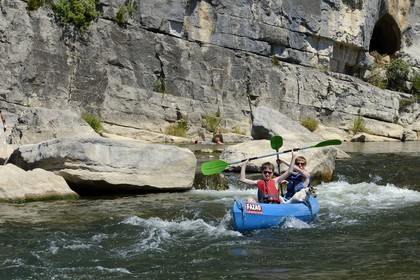 France, Ardeche, Ruoms, kayaks going down the Ardeche River in the Ruoms to Pradons Narrow Pass, rapids at the cirque de Giens