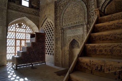 Iran, Isfahan Province, Isfahan, Jame Mosque, shabestan, Uljaitu Sultan hall, two mimbar and the stucco mihrab (center) where Koranic inscriptions mixed with floral motives