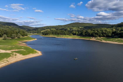 France, Nievre, Regional Natural Park of Morvan, Chaumard, Pannecière lake, angler on a boat (aerial view)