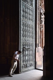 France, Bas Rhin, Strasbourg, old town listed as World Heritage by UNESCO, Notre Dame Cathedral, Sacristan Michel Bolli opens the main door of the Western facade in the early morning