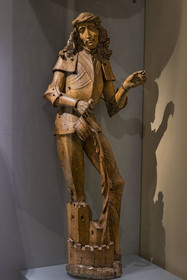 France, Paris, Musée de Cluny - Musée national du Moyen-Age (Middle Ages Museum in the former Hotel de Cluny), Saint Florian of Lorch, Austria c.1510, clad in figured armor extinguishing a fire, wood