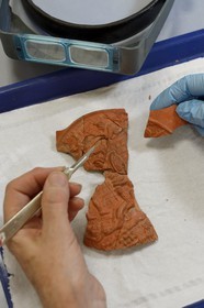 France, Isere, Vienne, Restoration and municipal archaeological study center (CREAM), conservation and restoration workshop of archaeological objects of metal, glass, ceramic as well as molding and preventive conservation, medallion dated II-III century applyed on vases representing the Hector's Death