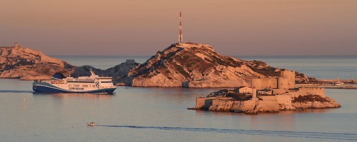 France, Bouches du Rhone, Marseille, Calanques National Park, archipelago of Frioul islands, La Meridionale Ferry arriving from Corsica and the Chateau d'If in the foreground
