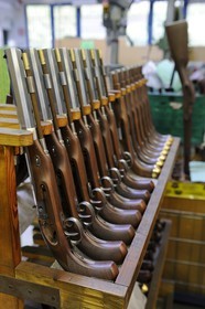 Italy, Lombardy, province of Brescia, Gardone Val Trompia, Davide Pedersoli & C manufacturer specialized in the production of historical muzzleloading guns, row of pistols before finishing