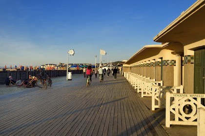 France, Calvados, Pays d'Auge, Deauville, the famous planks on the beach, lined with Art Deco style bathing cabins, each with the name of a celebrity who participated in the Deauville American Film Festival