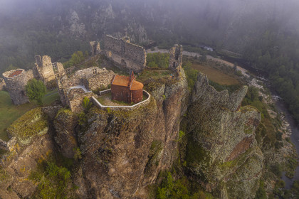 France, Haute Loire, Loire river Valley, Arlempdes, labelized the Most Beautiful Villages of France, ruins of the castle perched on a basalt rock (volcanic dyke) overlooking a Loire river meander (aerial view)