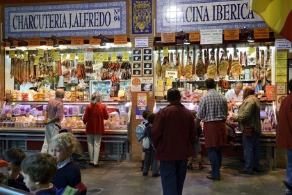 Spain, Andalusia, Seville, Triana district, Triana covered market, butcher stall, ham
