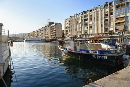 France, Var, Toulon, quai Kronstadt, the apartment blocks La Frontale designed by De Mailly following the 1944 bombing, the small fishing port in the foreground