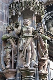 France, Bas Rhin, Strasbourg, old town listed as World Heritage by UNESCO, Notre Dame Cathedral, portal of Saint-Laurent in the north transept with the adoration of the biblical magi, the Moor  wise man Caspar (magus) with at his feet a dog with long hair