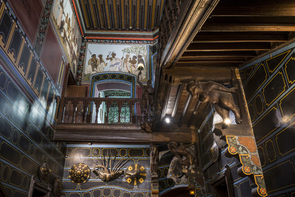 France, Pyrenees Atlantiques, Basque Country coast, Hendaye, Abbadia castle built in 1870 by Eugène Viollet-le-Duc for Antoine d'Abbadie d'Arrast, the Ethiopian paintings of the vestibule and the grand staircase, torchiere lamp statue representing Abdullah former Ethiopian slave freed and dead under the commune of Paris