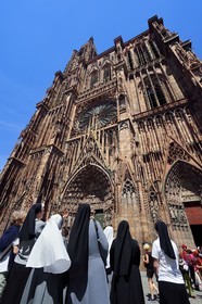 France, Bas Rhin, Strasbourg, old town listed as World Heritage by UNESCO, Notre Dame Cathedral, religious at the foot of the western facade