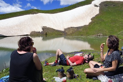 Georgia, Upper Svaneti (Zemo Svaneti), Mestia, hikers on the Koruldi Lake on the foothills of Mount Ushba