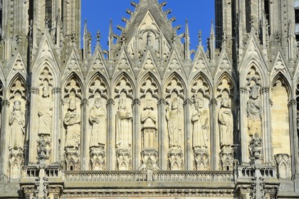 France, Marne, Reims, Notre-Dame de Reims cathedral, listed as World Heritage by UNESCO, the western facade, Baptism of Clovis (center) by the Bishop Saint Remi, in the presence of Clotilde, his wife and inspiration of his conversion, the Bishop assistants and of the hermit Montan