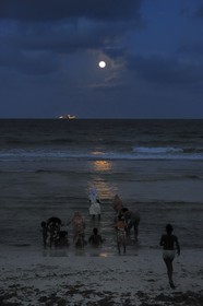 Tanzania, Dar es-Salaam, there is still lot of people at Coco Beach at dusk on Sunday