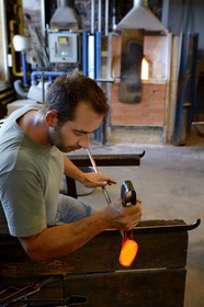 France, Moselle, Meisenthal, Centre international d'Art verrier (CIAV) (international glass centre), making of a christmas bowl made of glass, blowpipe put on a bench called «gamin mecanique»