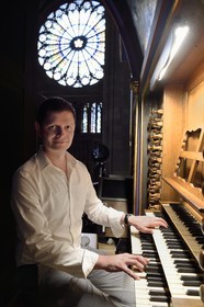France, Bas Rhin, Strasbourg, old town listed as World Heritage by UNESCO, Notre Dame Cathedral, the organist Guillaume Nussbaum at the the great organ that dominates the nave
