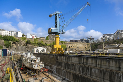 France, Finistère, Brest, the arsenal, the military port is a naval base of the French Navy, warship under construction in one of the two Pontaniou basins located in Pontaniou cove, the Lions building in the background on the right