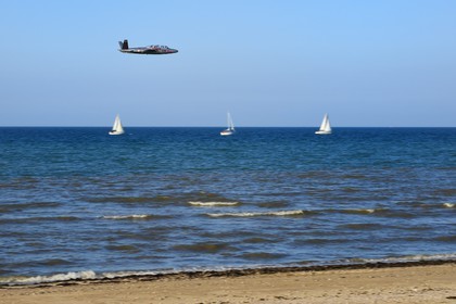 France, Calvados, Saint Aubin sur Mer, Two-seater military training plane that served in French naval aviation from 1959 to 1994, the Fouga CM-175 Zephyr over Juno Beach