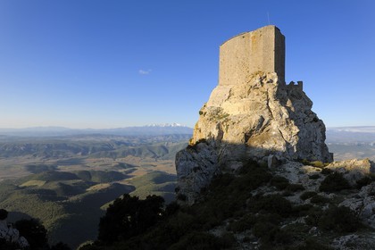 France, Aude, Cathar castle of Queribus, in front of Maury plain and the mount Canigou (2784 m) in the Pyrenees