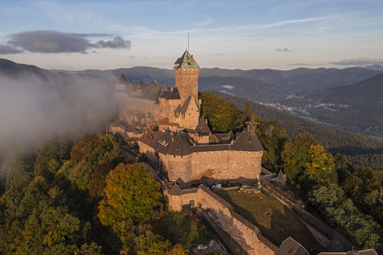 France, Bas Rhin, Orschwiller, Alsace Wine Road, the Haut Koenigsbourg Castle positioned on the Vosges foothills and overlooking the plain of Alsace to the east as well as the Villé and Bruche valleys to the west in the background (aerial view)