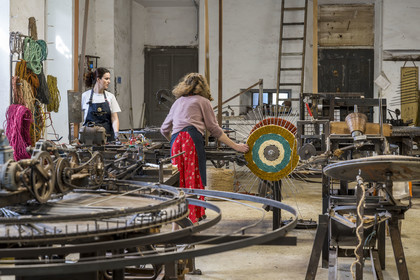 France, Drome, Drome provencale, Nyons, La Scourtinerie, the last scourtin factory in Provence, traditional filters used in the production of olive oil but also designed today as decorative objects made of coconut fiber, manufacturing of scourtins in their workshop on custom-made circular looms