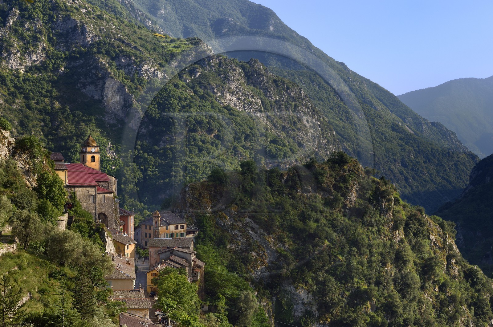 France, Alpes-Maritimes, Roya Valley (Nice hinterland), at the foot of the Mercantour National Park, perched village of Saorge, Saint-Sauveur (St. Saviour) church overlooks the valley