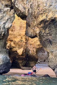 Portugal, Algarve, Lagos, Kayak tour at the foot of the steep cliffs of Ponta da Piedade