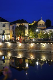 France, Vosges, Epinal, quai Jules Ferry along the Moselle River and the Basilica of St. Maurice in the background