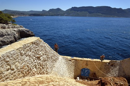 France, Bouches du Rhone, Cassis, National Park of the Calanques, Cassis bay, Cacau Point, restoration of Hoppers by roped workers of Alpes de lumière association