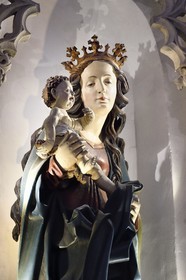 France, Haut Rhin, the Alsace Wine Route, Thann, the 14th century Saint-Thiebaut Collegiate Church, Madonna of the vine growers dating from 1510, little Jesus hides a bunch of grapes in his hand