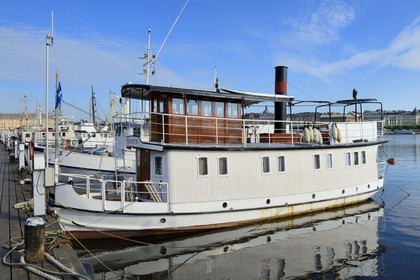 Sweden, Stockholm, island of Skeppsholmen, old boats moored at Östra Brobänken, the ship Violette built in 1928 as a tugboat for towing timber on the northern swedish rivers