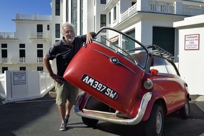 France, Pyrenees Atlantiques, Basque Country coast, Guethary, former art deco Guétharia hotel built in the 1920s turned into a residence, French journalist, writer and director Alain Gardinier driving his BMW Isetta