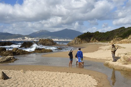 France, Corse du Sud, Gulf of Ajaccio, Capitello beach at the mouth of the Casavone pond and Ajaccio in the background