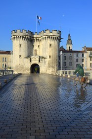 France, Meuse, Verdun, Porte Chaussee, gate of the 15th century, official entry of the city since its construction, defense tower of the great wall that encircled the city in the medieval seen from the Nation Place and the bridge over the Meuse River