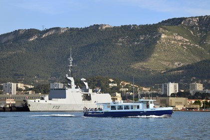 France, Var, Toulon, water bus passing in front of the naval base (Arsenal), Mount Faron in the background