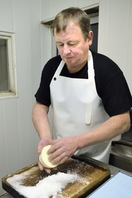 France, Haut Rhin, Wasserbourg, Ferme-auberge (farm-inn) Buchwald, marcaire Michel Wehrey in the production of munster AOP cheese (cow's milk), 24-hour Munster salting