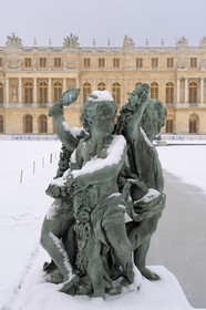 France, Yvelines, snow covered park of the Chateau de Versailles, listed as World Heritage by UNESCO, Parterre d'eau in front of the castle
