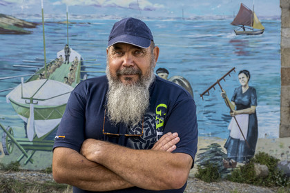 France, Finistère, Iroise Sea, Molene Island, the shelter of the former rowing lifeboat Amiral Roussin covered with frescoes which retrace the life and history of the island, Guy Rocher, president of the SNSM station of Molene