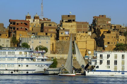Egypt, Upper Egypt, Nubia, Nile Valley, Aswan, felucca and cruise ship on the Nil